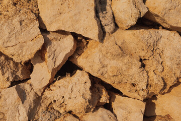 Close-up of stone wall in bright sunlight