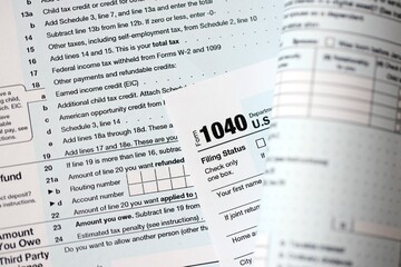 1040 US individual income tax return form blank close up. Few pages of united states tax blank