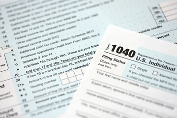 Fototapeta premium 1040 US individual income tax return form blank close up. Few pages of united states tax blank