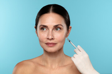 Woman Receiving Cosmetic Injection in Medical Environment