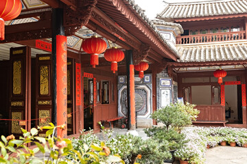 Fototapeta premium Traditional chinese house with the beautiful yard in the Yunnan Ethnic Village, Kunming China