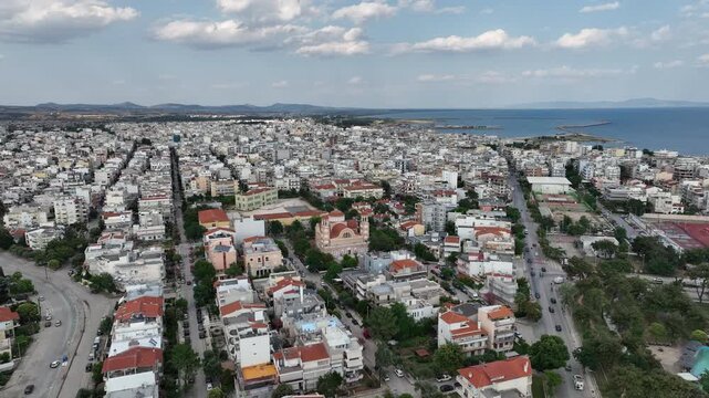 Dense Urban Layout of Alexandroupoli with Prominent Church and Coastal Horizon
