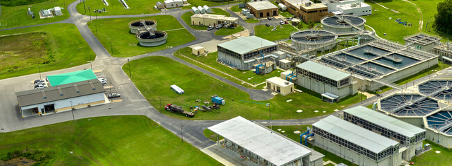 Aerial view of modern water cleaning facility at urban wastewater treatment plant. Purification...