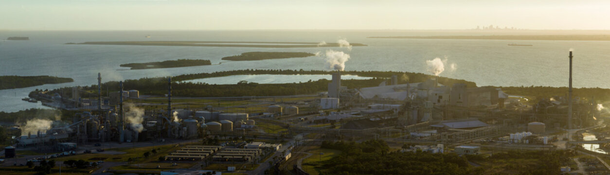 Industrial facility for chemical production of phosphoric acid polluting atmosphere with toxic emissions. Mosaic Riverview Plant in Tampa, Florida. Factory for handling and processing of phosphates