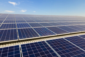 Photovoltaic panels on solar rooftops of commercial building for producing clean ecological electrical energy. Renewable electricity with zero emission concept