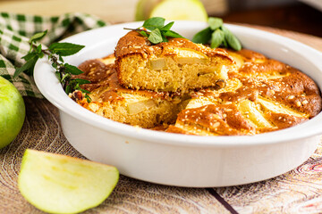 Ruddy apple pie with mint and golden crust close-up