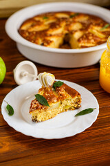 Golden charlotte with juicy filling and sesame seeds on top