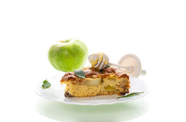 Ruddy crust of an appetizing apple pie on a white background