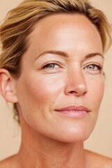 Obraz premium Portrait of a well-groomed middle-aged woman with a confident expression in a warm setting