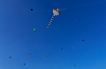 Cholula,Mexico,February-16-2025: Blue sky decorated with kites in Cholula
