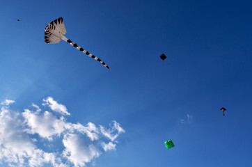 Cholula,Mexico,February-16-2025: Kites dancing in the wind above Cholula