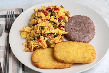 scramble eggs with sausage patty and hash browns