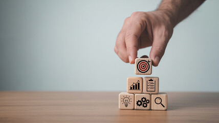 Business Strategy and Goal Setting with Wooden Blocks Stacked to Represent Objectives and Planning for Corporate Success
