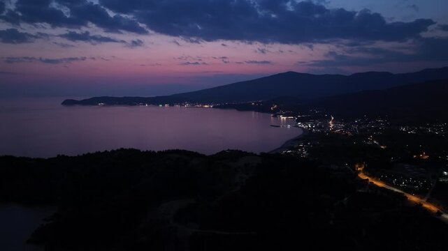 Sunset Horizon with Illuminated Coastline on Thasos