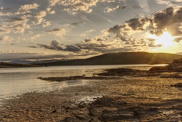 Naklejka premium Sandy beach on the island of Rab, Croatia in the morning with sunrise.