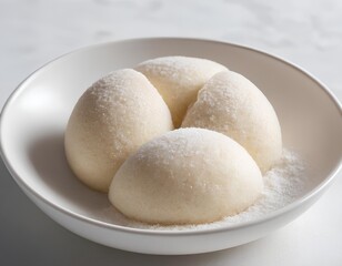 Raw Dough Balls in Flour-Dusted Bowl Ready for Baking