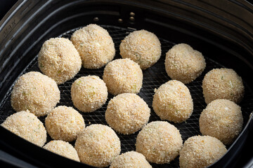 Crispy tuna potato croquettes with breadcrumb coating in air fryer.