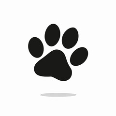 Simple black paw print vector icon with subtle shadow, perfect for pet care, animal rescue, veterinary clinics, or wildlife conservation design projects.