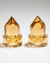 Geometric Amber Crystal Towers on Glass Bases with Light Reflection