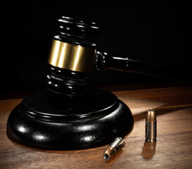 Closeup of two cartridges and judge gavel
