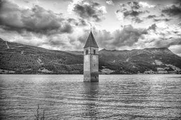 The iconic submerged Church Tower of Graun, Lake Reschensee, Italy