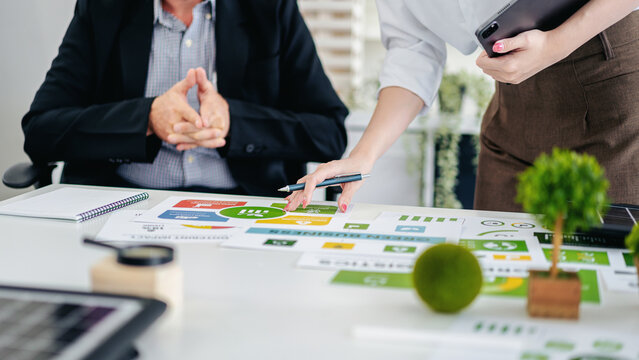 Professionals Collaborating on Green Business ESG Strategy Driving Sustainable Corporate Practices and Environmental Responsibility Initiatives
