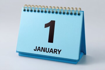 Light blue desk calendar showing the first day of january isolated on white background