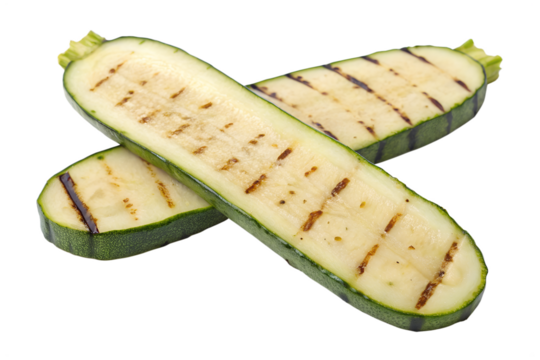 Two fresh green zucchini halves are grilled and sliced, showing distinct marks, perfectly isolated on a transparent background as a PNG file.