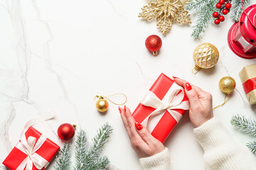 Christmas present and decorations on white.