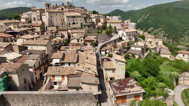 Drone View of Medieval Italian Village Surrounded by Lush Green Hills