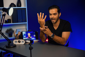 Broadcaster talking to listener on live streaming online, recording by smartphone setting on social...