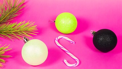 Vibrant Pink Background: Lime, Mint, and Black Glitter Christmas Ornaments with Candy Cane.