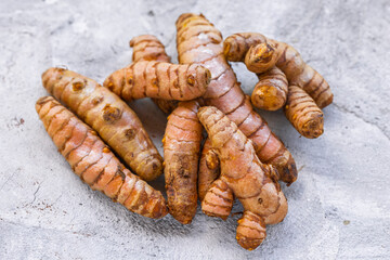 Fresh and Ground Turmeric on Rustic Background – Natural Health and Culinary Ingredient