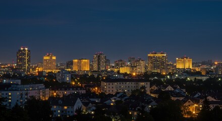 Obraz premium Nightscape of Graz, Austria: Illuminated Buildings and Dark Sky
