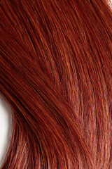 Naklejka premium red hair, long glossy straight hair, macro hair texture
