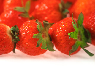 Fresh and juicy red strawberry on white background. Premium high quality organic product. Food supply industry. Close up details shot.