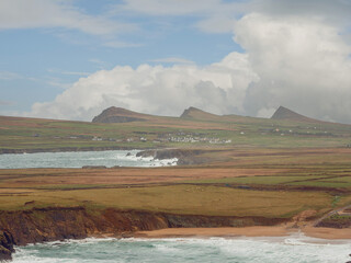 Picturesque scenery of Clogher Strand in county Kerry, Ireland. Powerful ocean and rough stone...
