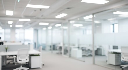 Blurred modern office interior with large windows and bright daylight. Abstract business background concept.