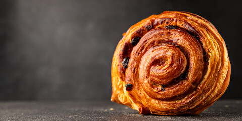 Raisin bun sweet pastry dessert puff pastry fresh delicious gourmet food background on the table...