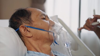 Close up of patient's face using oxygen mask in hospital, healthcare concept - Powered by Adobe