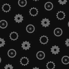 Cartoon vector seamless pattern of gear silhouettes isolated on black background.	
