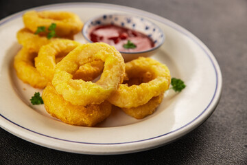 Colmar rings fried food fries fast food crispy appetizer fresh delicious gourmet food background on...