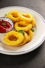 Colmar rings fried food fries fast food crispy appetizer fresh delicious gourmet food background on the table rustic food top view copy space