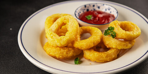 Colmar rings fried food fries fast food crispy appetizer fresh delicious gourmet food background on the table rustic food top view copy space
