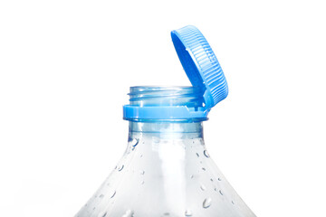 Close up of new cap attached to plastic bottle, connected to the neck of the bottle by solid tab attached to safety ring. They are intended to encourage recycling, as part of the fight against litter.