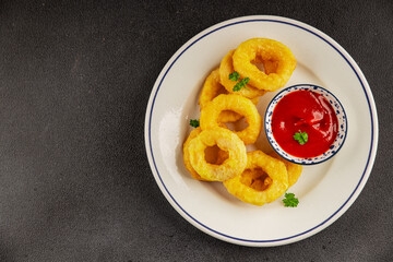 Colmar rings fried food fries fast food crispy appetizer fresh delicious gourmet food background on...