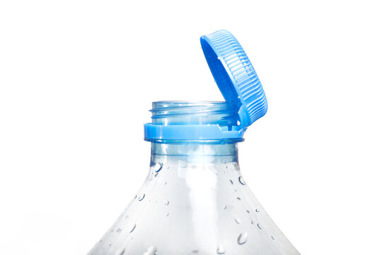 Close up of new cap attached to plastic bottle, connected to the neck of the bottle by solid tab attached to safety ring. They are intended to encourage recycling, as part of the fight against litter.