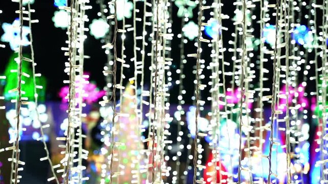 Horizontal video of Christmas light display and holiday cheer.
