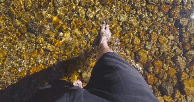 Feet Walking In Clear Golden Water In Yosemite Park