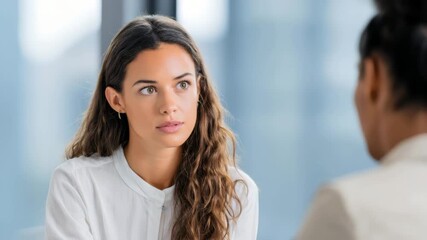 Thoughtful business discussion between two colleagues in modern office environment - Powered by Adobe